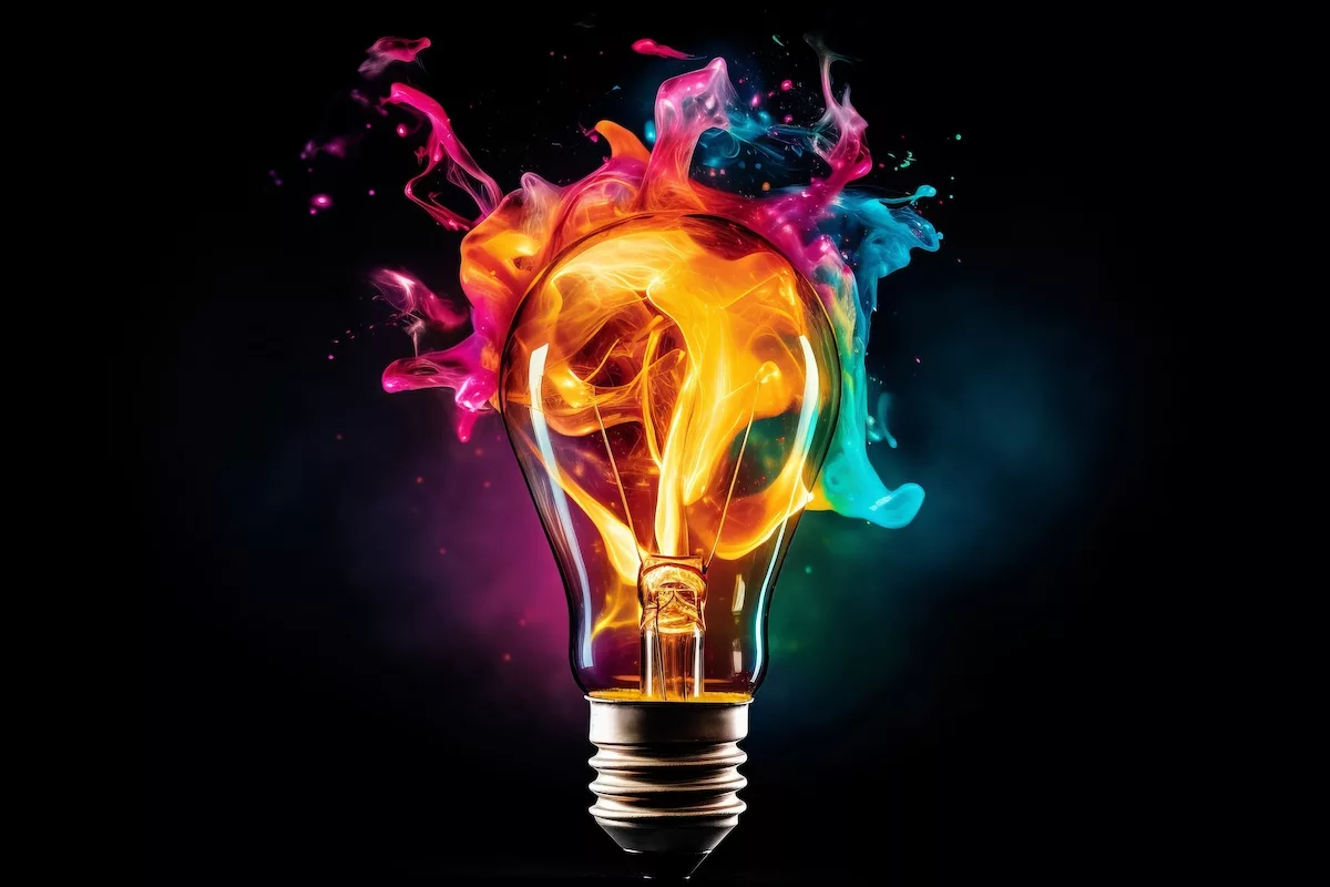 a colorful lightbulb explodes depicting the bright ideas of our Executives in Residence Team