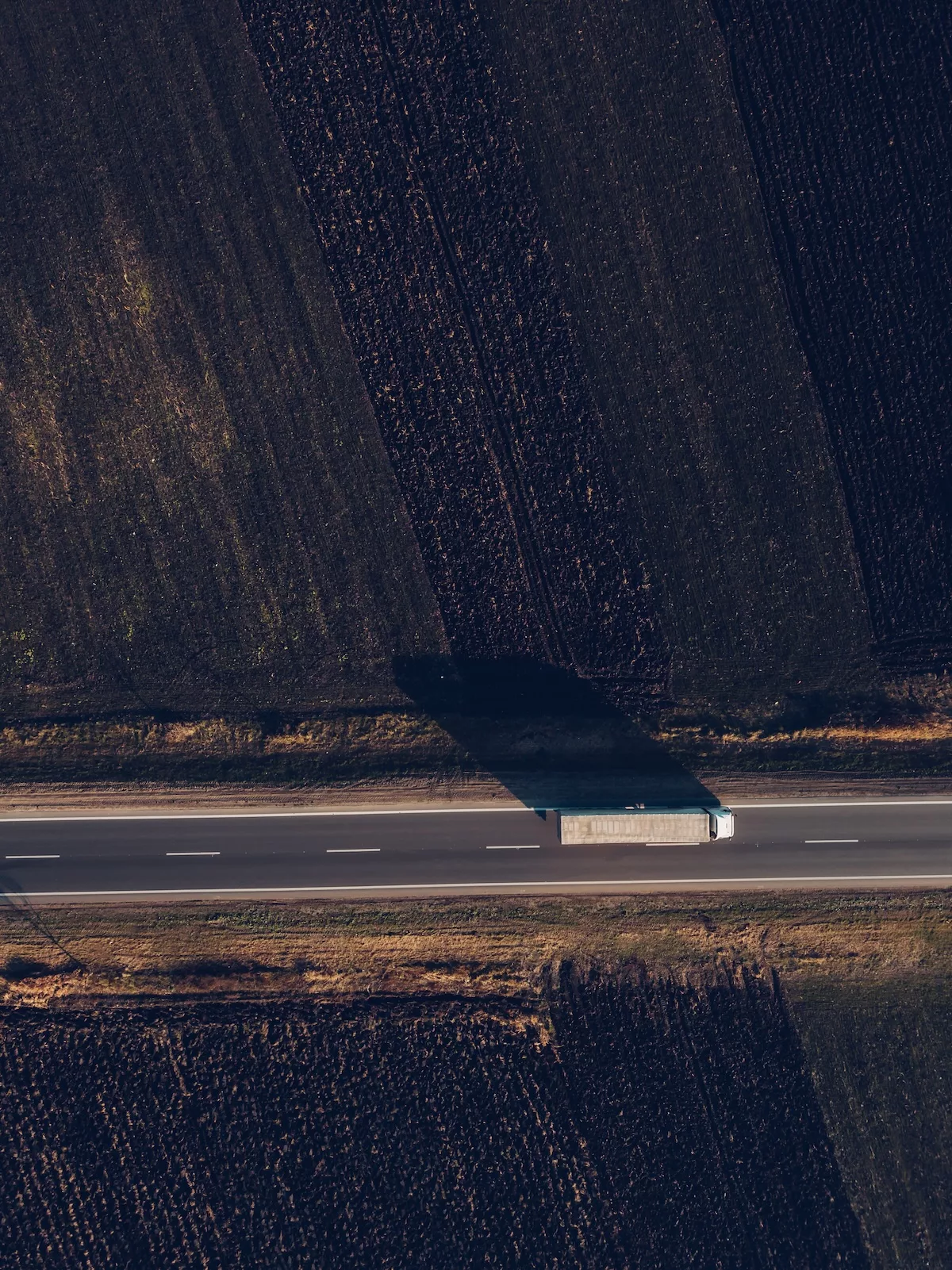 Aerial view of freight transportation truck on the road