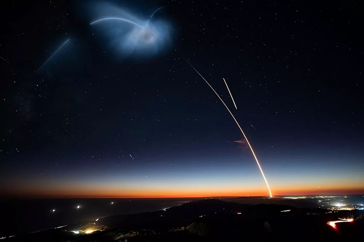 Is a time-lapse image of a rocket launch taking place at night