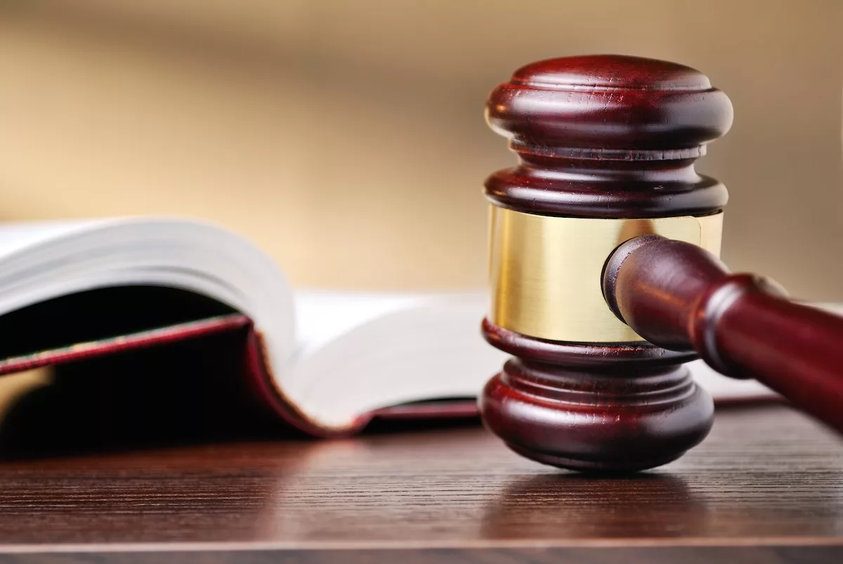 mediation, arbitration, litigation with a gavel on a wooden desk