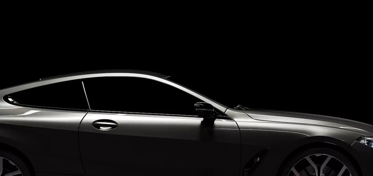 Outline of modern black premium car in studio light.