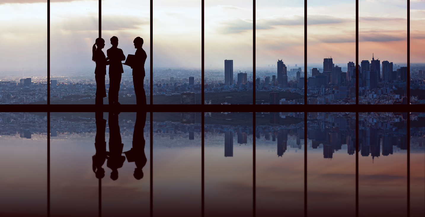 Businesspeople in front of urban cityscape.
